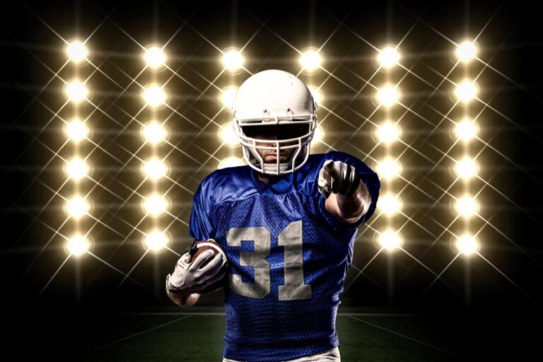 football player with blue uniform front lights