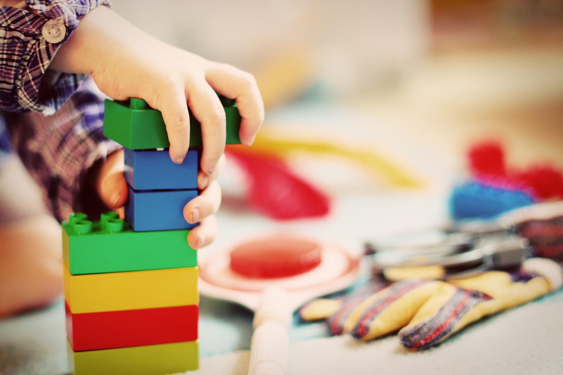 A child building with blocks.