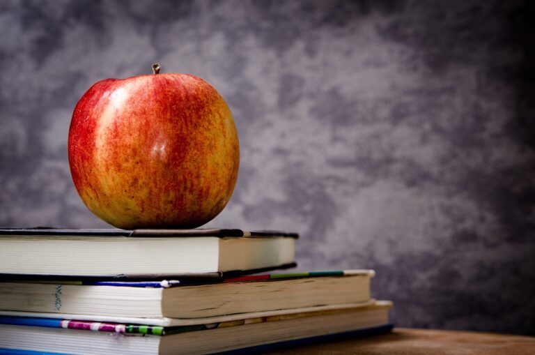An apple and textbooks
